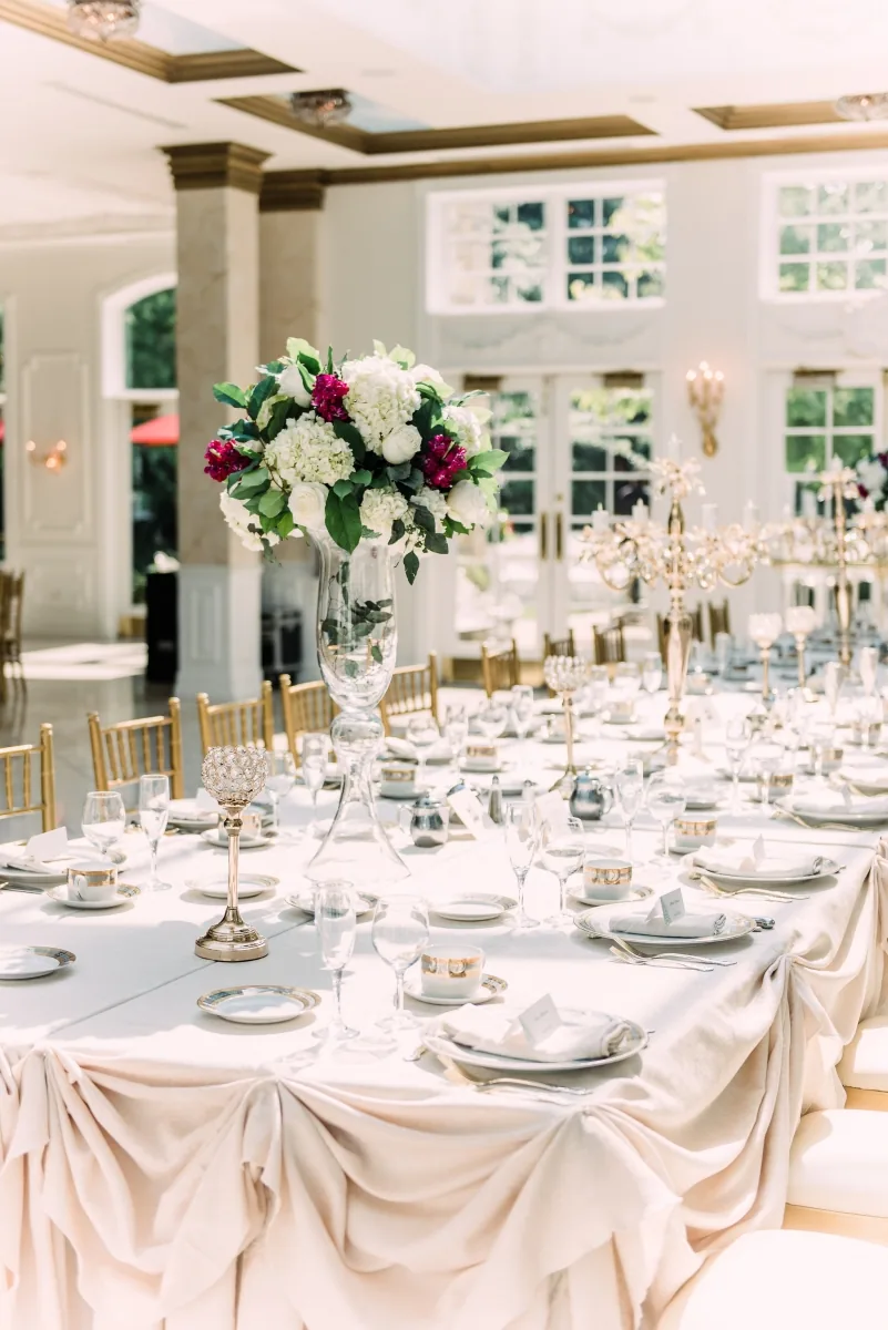 All-white wedding reception decor by Poonam Creations